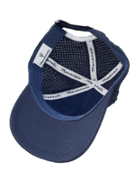 Inside view of navy blue structured cap with perforated mid and back panels.