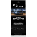 Retractable black Maserati banner with the slogan ‘Go the Distance,’ featuring a car driving at night with city lights, and promoting the Extended Warranty Program with coverage up to 10 years.