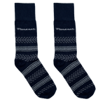 A pair of black mid-calf socks with a tire tread pattern and the Maserati logo near the top.