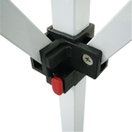 Close-up of a canopy tent frame joint with a black plastic connector and red push-button locking mechanism.