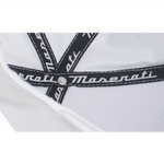 Close-up of the inside of a white baseball cap showing black inner lining strips with white Maserati logos and visible stitching detail.