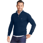 A man wearing a navy blue quarter zip sweater with a mock neck, featuring a grey silicone zipper pull and Trident logo. The sweater has contrasting grey details and embroidered Maserati Trident logo on the left chest.