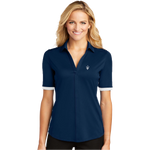 A woman wearing a navy blue polo shirt with white contrast sleeve piping and a V-neck collar. The polo features an embroidered logo on the left chest.